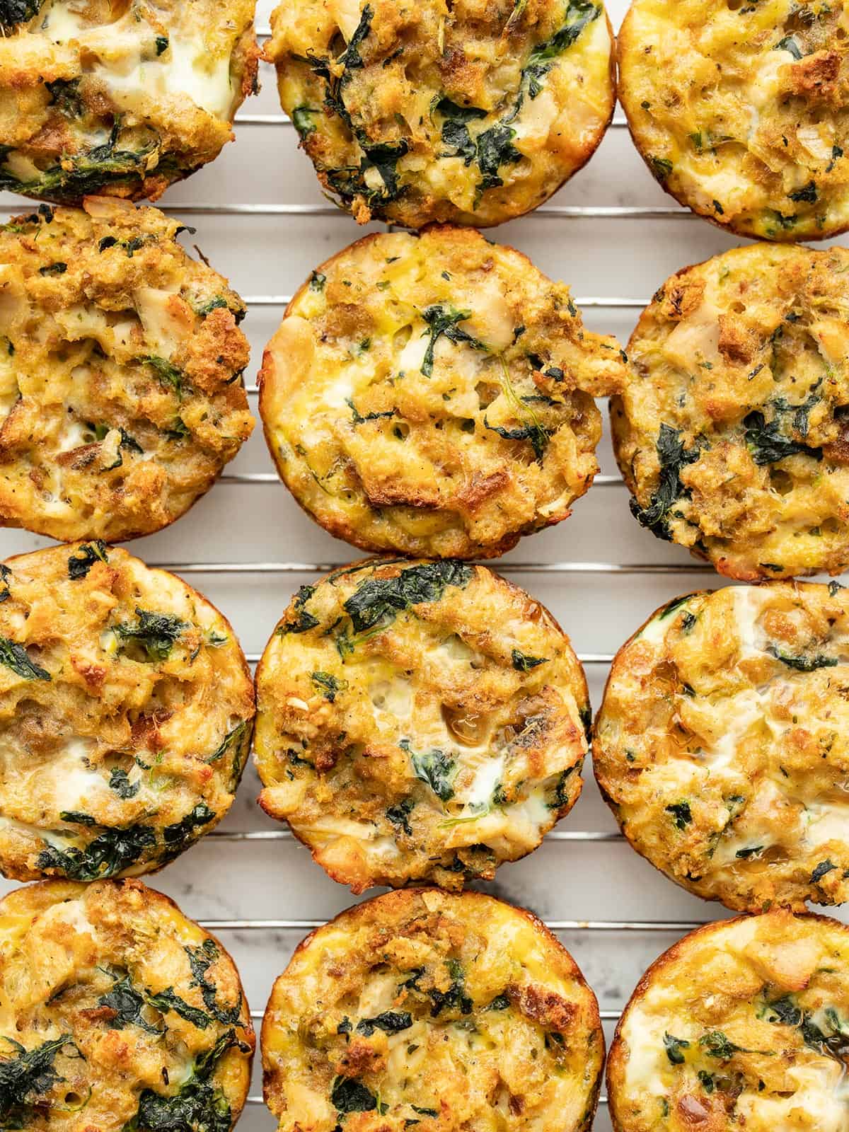 close up overhead shot of stuffing muffins on a cooling rack