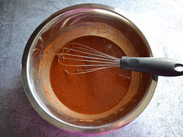One cup of broth added to spices in mixing bowl and whisked together