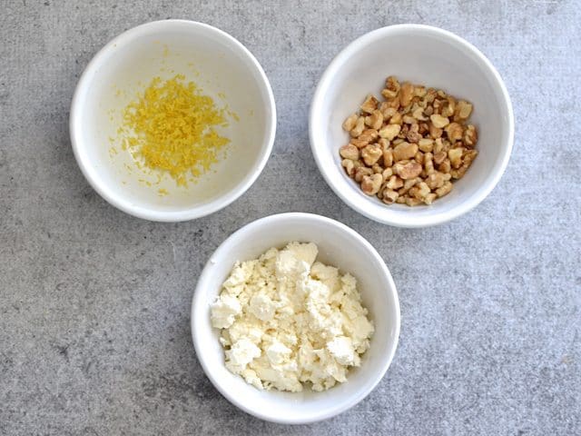 Toppings (three small bowls, one with lemon zest, one with feta cheese and one with walnuts)