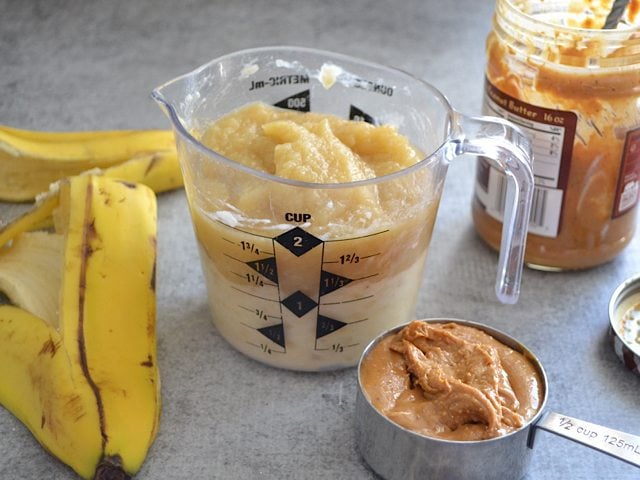 Mashed Bananas, Apple Sauce and peanut butter in measuring cup