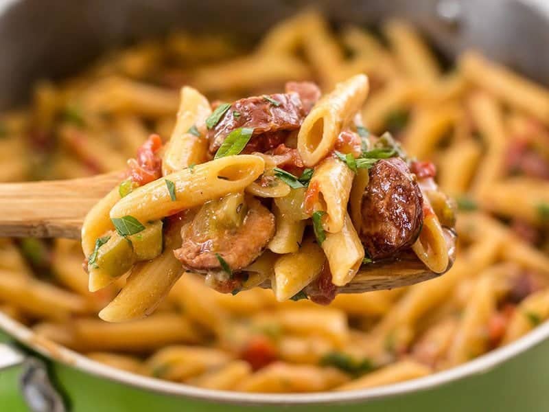 Celebrate like you're in Louisiana with this easy, filling, and inexpensive one pot favorite, Pastalaya. It's the shortcut pasta version of Jambalaya! BudgetBytes.com Side view of a spoonful of Pastalaya being scooped out of the pot