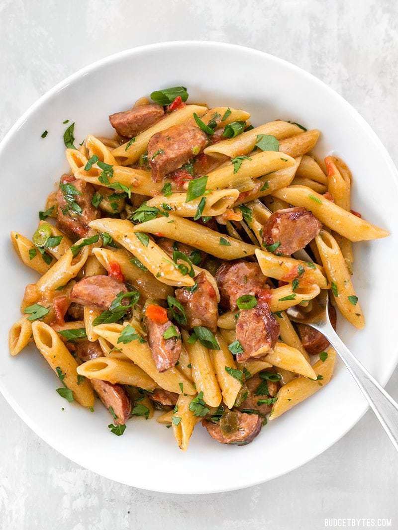 A big bowl of Pastalaya garnished with parsley and green onion