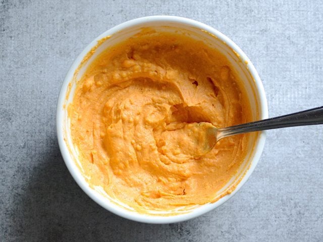 Mixed Egg Filling in bowl with spoon