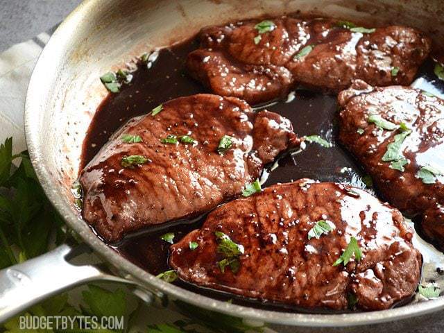 Close up of a pan of Blackberry Sage Pork Chops