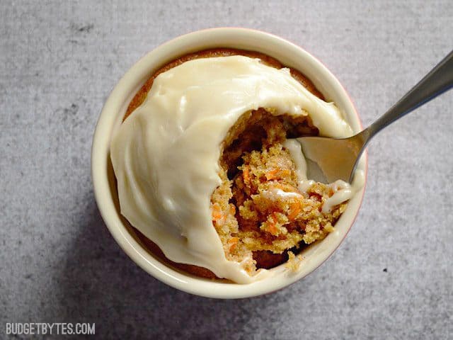 Top view of one cup of Carrot Cake with a spoon