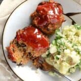 Mini turkey loaves with vegetables, served on a plate.