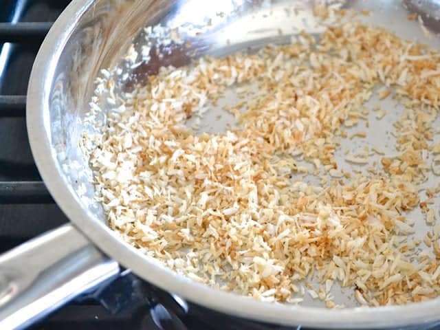 Toasting coconut in pan on stove top