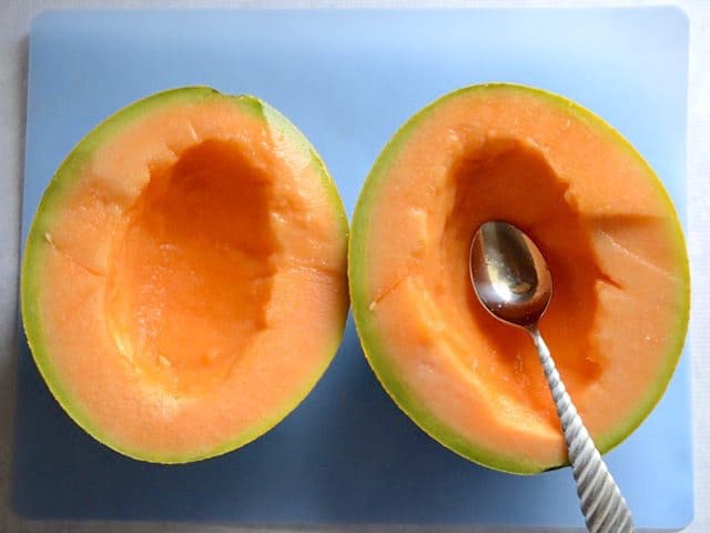 Cantaloupe cut in half and seeds scooped out
