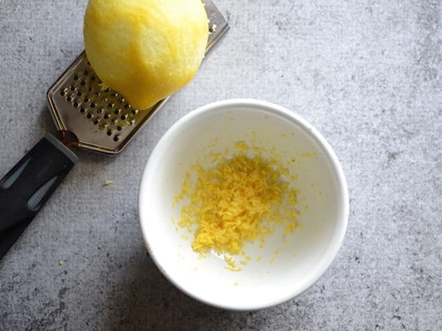 Zesting Lemon zest into small bowl
