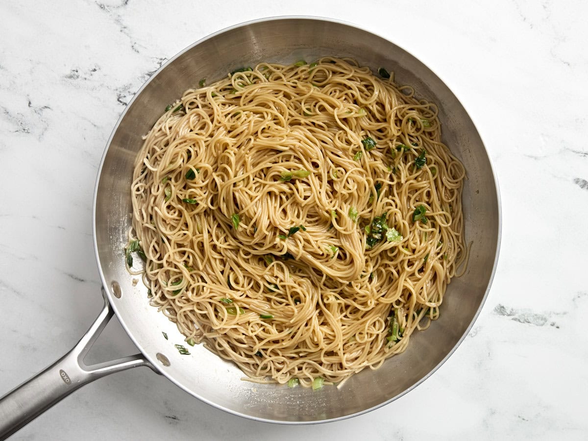 These Garlic Noodles are both sweet and savory with a strong garlic punch. They make the perfect side dish to any Asian inspired meal. Budgetbytes.com Finished homemade garlic noodles in a skillet.