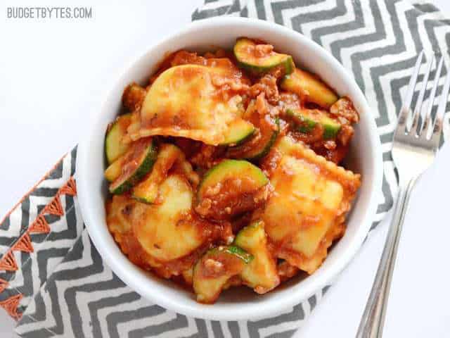 Adding a healthy dose of vegetables to these grocery store staples makes this Zucchini Sausage Ravioli a quick, delicious, and healthy weeknight dinner. Budetbytes.com Overhead view of a bowl full of Zucchini Sausage Ravioli