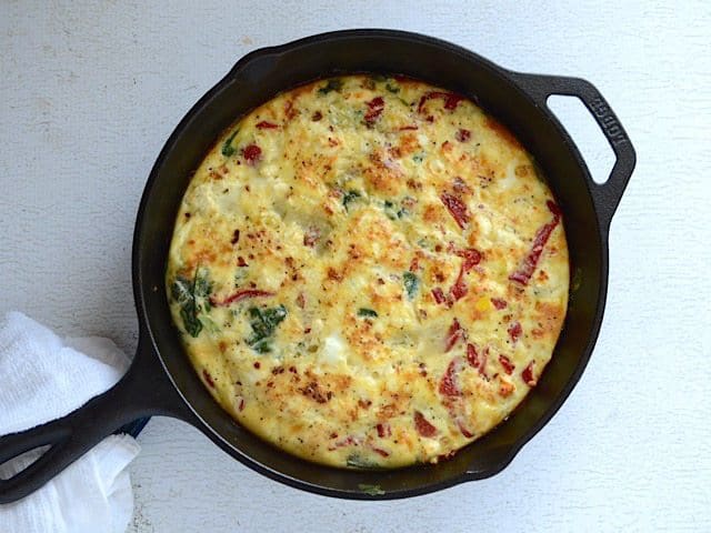 Use leftover ingredients to make a frittata, like this Roasted Red Pepper and Feta Frittata. Great for breakfast, brunch or even dinner! Budetbytes.com Baked Roasted Red Pepper and Feta Frittata in the skillet, not sliced