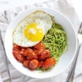 Pasta with parsley pesto and blistered tomatoes.