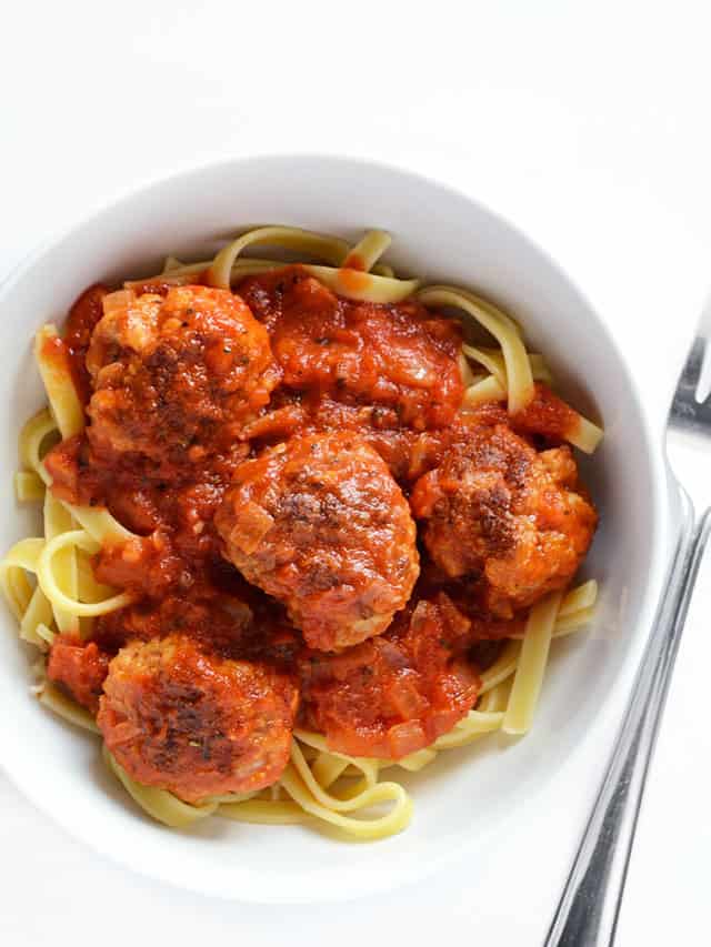 These quick and easy skillet meatballs are made in one skillet with marinara and pack a huge flavor punch. They're my new weeknight dinner favorite! Budetbytes.com Overhead view of a bowl of pasta with meatballs and marinara