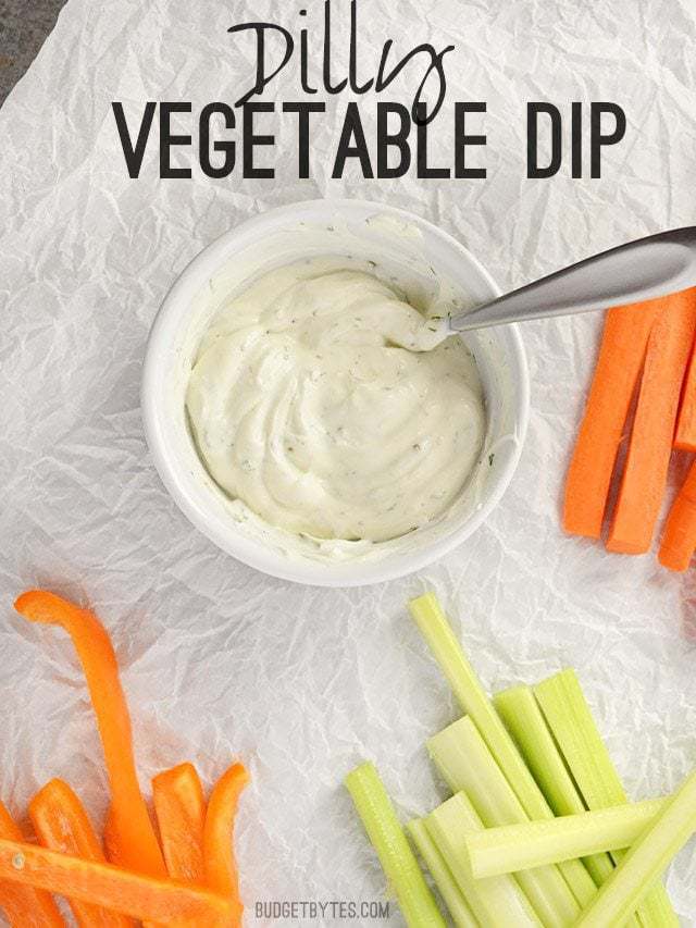 This super quick and flavorful vegetable dip makes snacking on fresh produce easy and delicious. Use as a vegetable or chip dip, or sandwich spread. Budetbytes.com A small bowl of Dilly Vegetable Dip surrounded by vegetable sticks