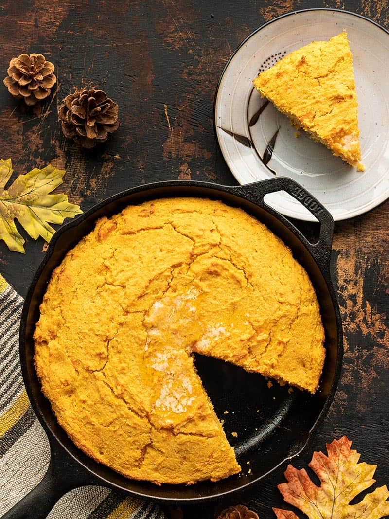 Mashed sweet potato, fragrant spices, and rich sour cream make this Sweet Potato Cornbread a decadent fall treat. Budgetbytes.com Sweet potato cornbread with one sliced removed and on a plate on the side