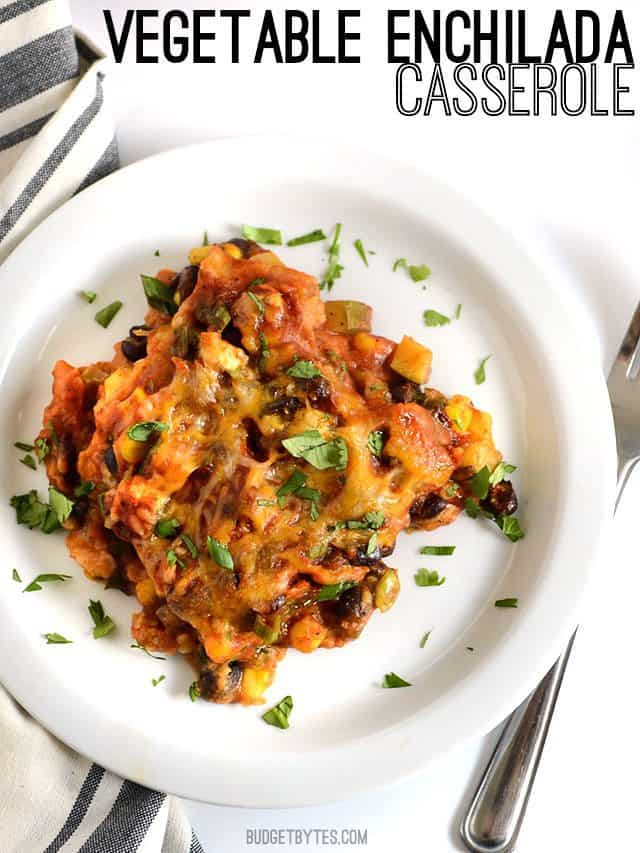 A colorful mix of vegetables, homemade enchilada sauce, corn tortillas, and cheese make this Vegetable Enchilada Casserole an ultimate comfort food. Budetbytes.com One serving of Vegetable Enchilada Casserole on a plate, title text at the top
