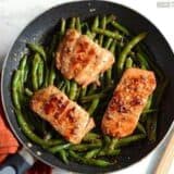 Sesame-glazed salmon served with green beans.
