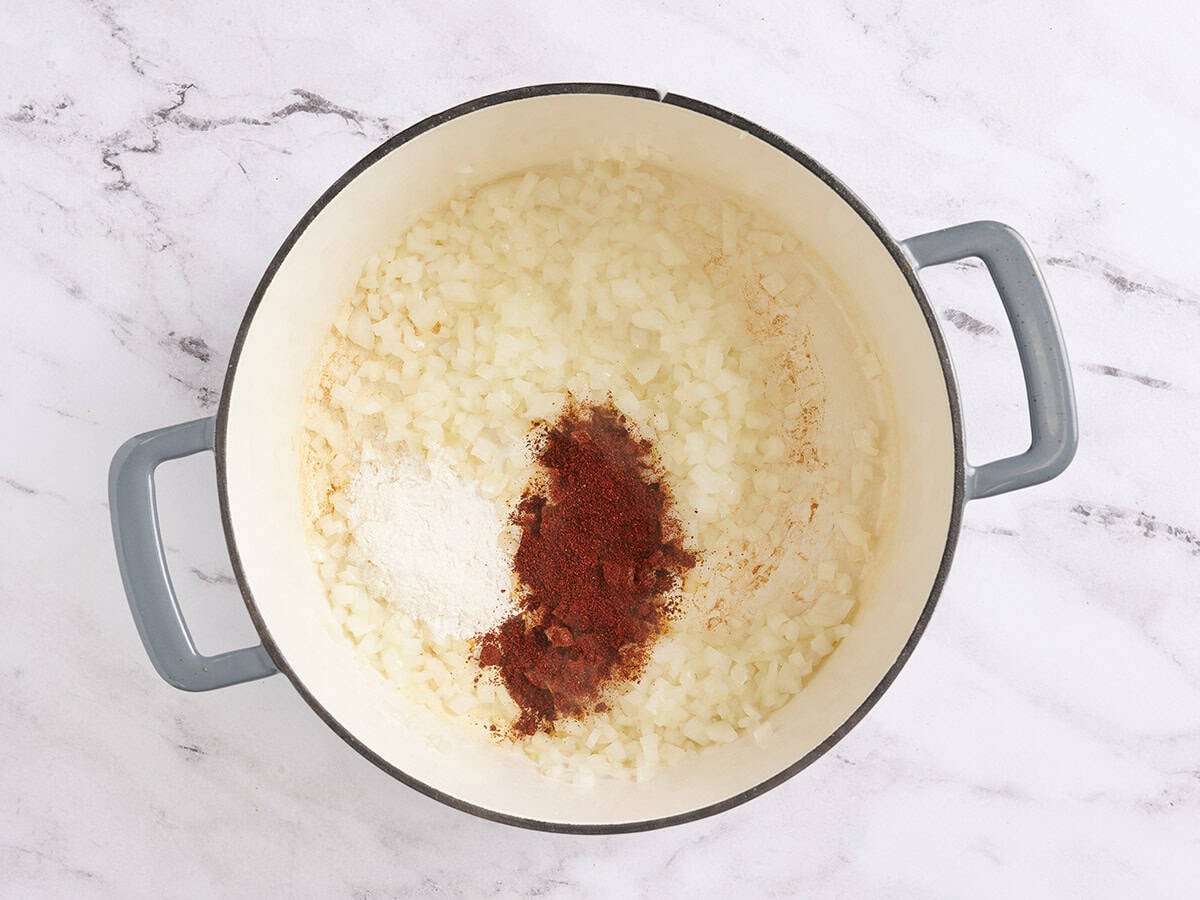 Flour and chili powder added to sauteed diced onion.