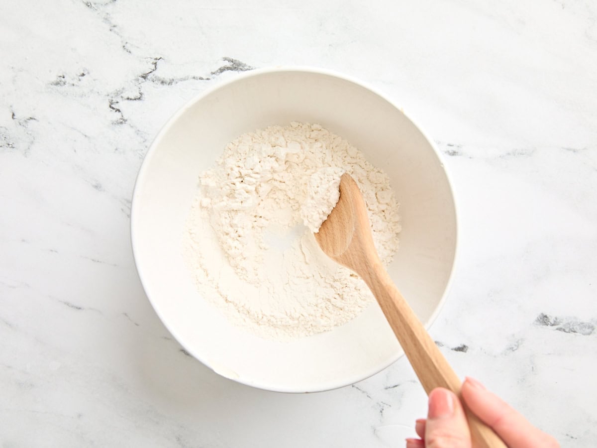 The dry ingredients for naan dough in a mixing bowl.