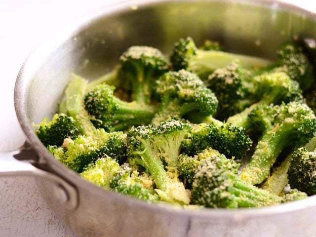 This super fast Garlic Parmesan Broccoli is an easy side dish with versatile flavors that will go with just about any weeknight meal. Budetbytes.com Side view of Garlic Parmesan Broccoli in the skillet