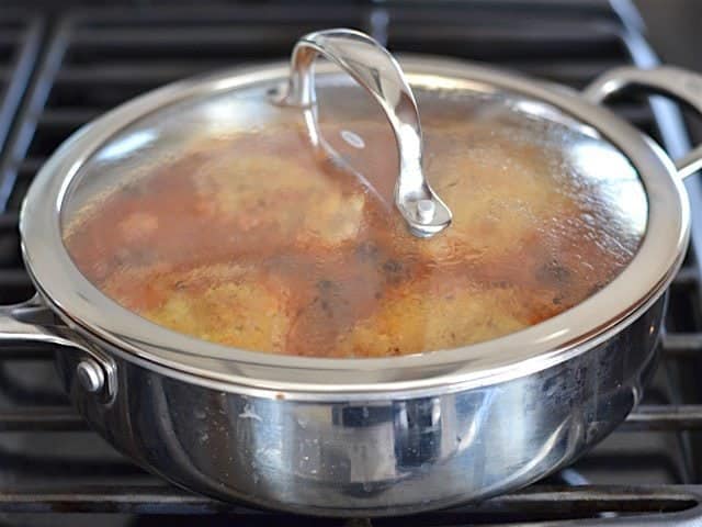 Lid on skillet, chicken and orzo simmering.