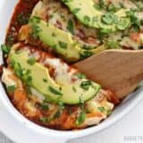 Weeknight enchiladas served with a scoop.