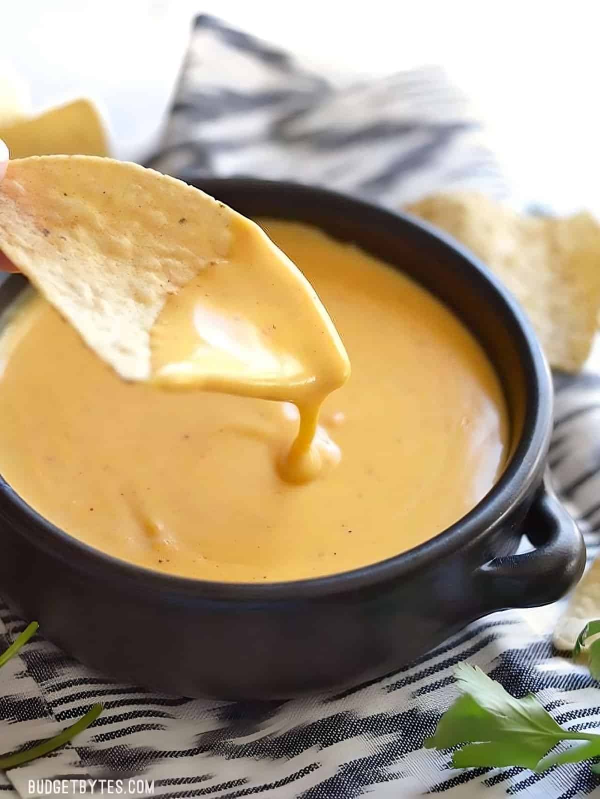 This rich and tangy nacho cheese sauce only takes about 5 minutes to make and uses only real, simple ingredients. nacho cheese sauce