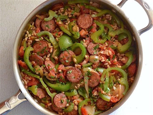 Use farro or any cooked grain in this simple and satisfying weeknight meal. Smoked Sausage with Peppers is a classic flavor combination that always wins! Budetbytes.com Top Smoked Sausage Skillet with Parsley