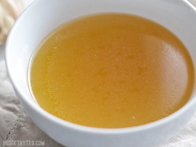 Instant Pot Congee is a warm and comforting rice Using a pressure cooker to make chicken stock is fast and easy. Follow these step by step photos to make this insanely delicious Instant Pot Chicken Stock. BudgetBytes.com Close up side view of a bowl full of golden chicken stock