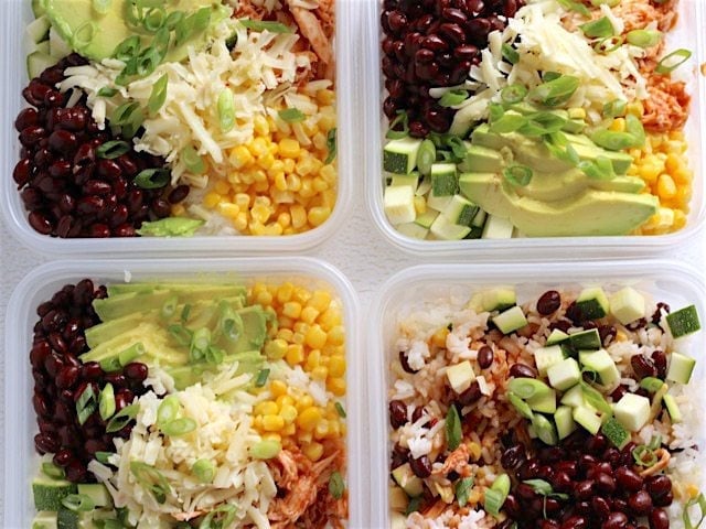 BBQ Chicken Burrito Bowls are an easy, customizable lunch option that is great both hot or cold! Vegetarian substitutions included. Great for meal prep! BudgetBytes.com BBQ Chicken Burrito Bowls in four square plastic meal prep containers