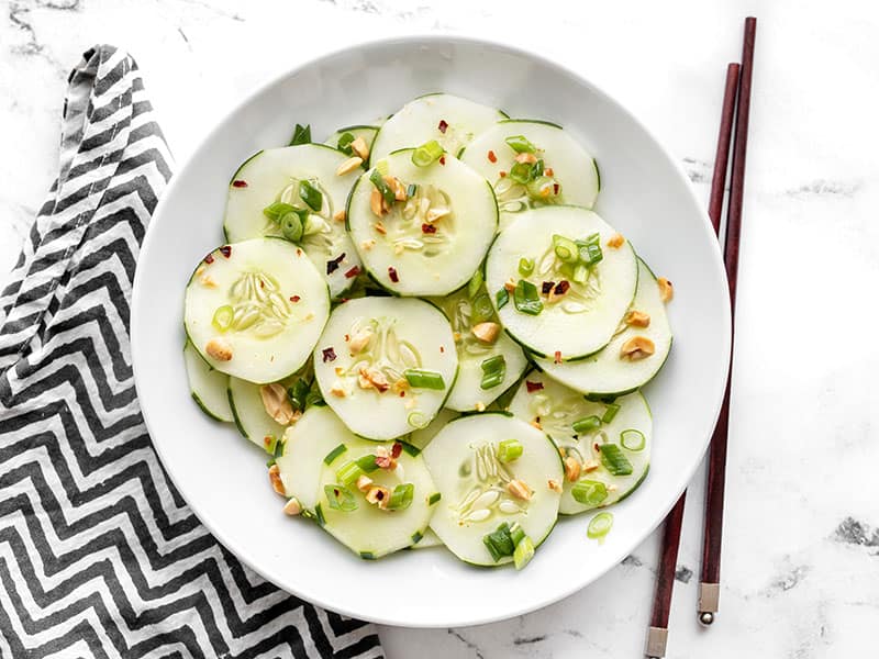 Overhead view of a bowl full of sesame cucumber salad