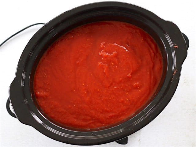 Broth and Tomatoes added to other ingredients in slow cooker