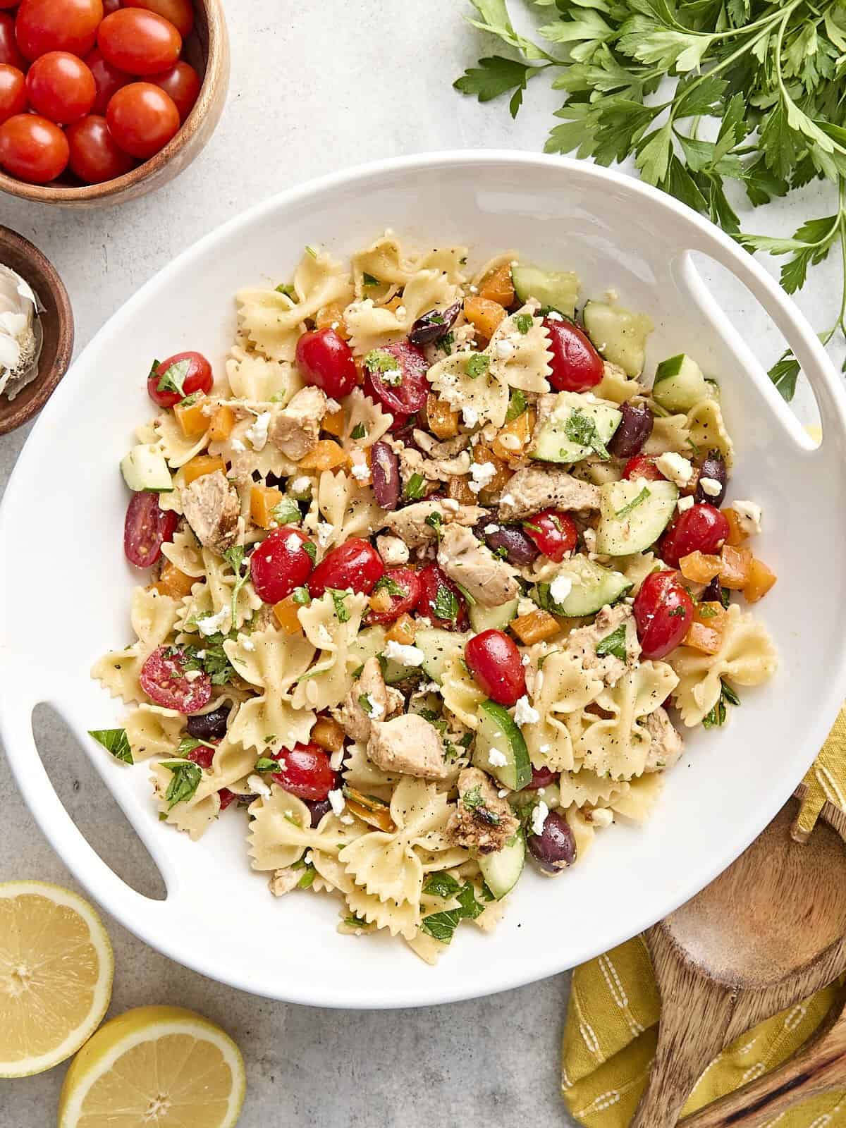 Overhead view of a homemade Greek chicken pasta salad on a platter.