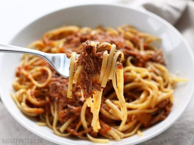 Close up of a forkful of Sunday Slow Cooker Beef Ragù