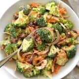 Broccoli salad with honey yogurt dressing served with a fork.