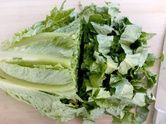 Chopping lettuce with knife