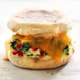 Baked freezer-ready breakfast sandwiches on a plate.