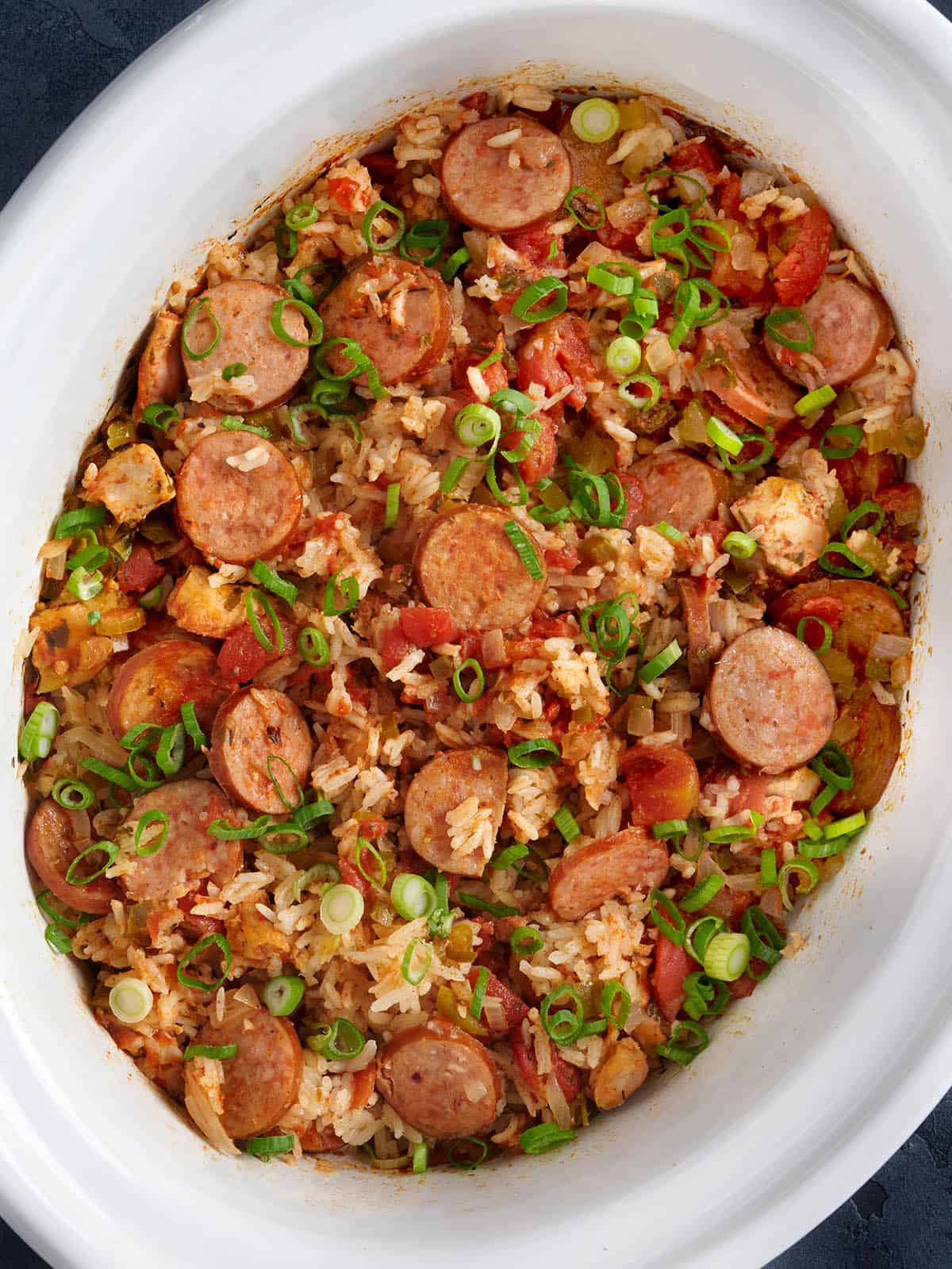 Jambalaya in a white crockpot. 