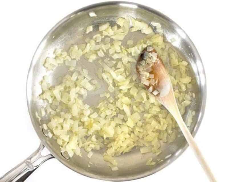 Sauteeing onions in a skillet.
