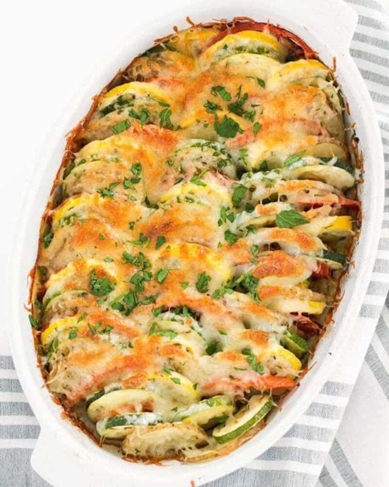 Vegetable tian in a white baking dish.