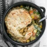 Vegetable pot pie skillet served in a ceramic cookware.