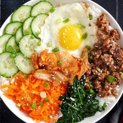 Overhead view of a bibimbap bowl meal.