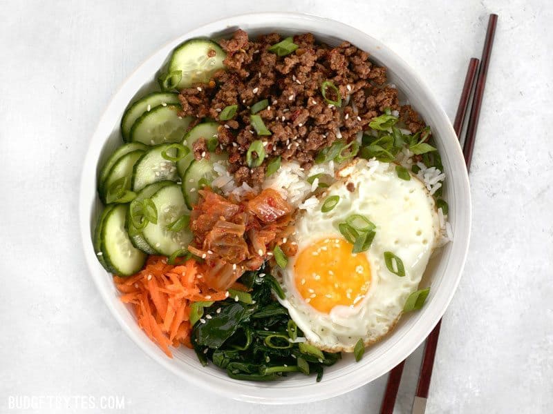 Bibimbap is the ultimate bowl meal with plenty of color, flavor, and texture to keep your taste buds happy and your stomach full. BudgetBytes.com Build Bibimbap Bowls