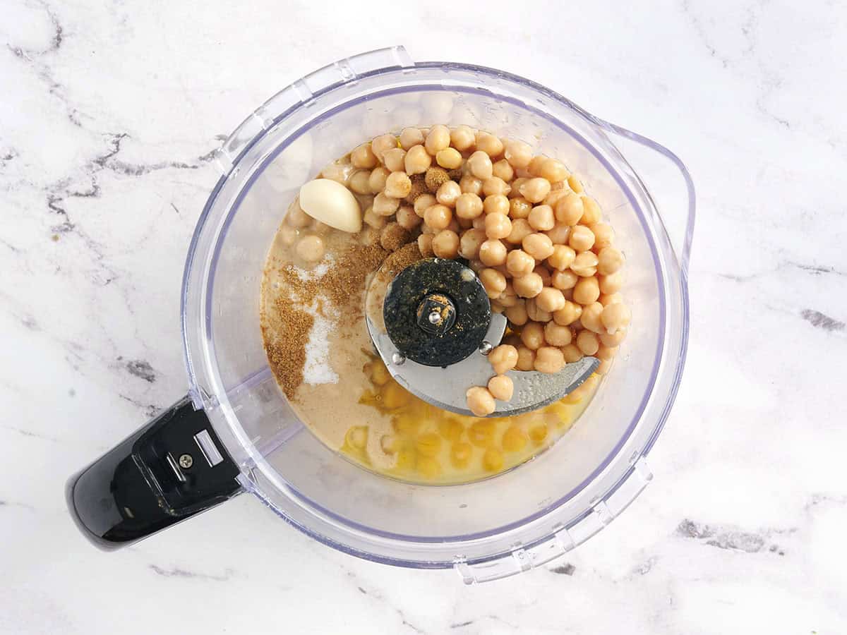 Chickpeas, garlic, and tahini in a food processor.