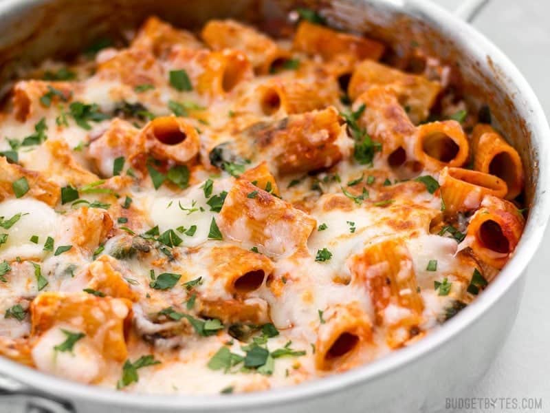 This Cheesy Rigatoni Skillet is a fast comfort meal for when you need dinner on the table fast! Like a fee-form lasagna packed with mushrooms and spinach. BudgetBytes.com Close side view of Cheesy Rigatoni Skillet