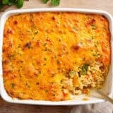 Overhead view of chicken and rice casserole with a spoon.