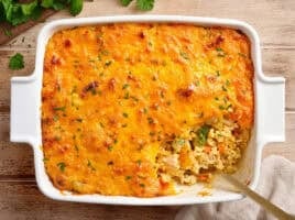 Overhead view of chicken and rice casserole with a spoon.