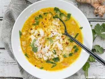Golden Coconut Lentil Soup is a light and fresh bowl with vibrant turmeric and a handful of fun toppings. BudgetBytes.com