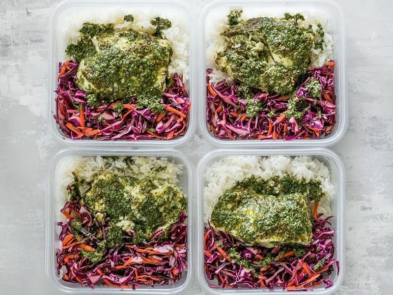 These light and fresh Baked Chimichurri Fish Bowls are simple to prepare and make great cold lunches for the rest of the week. BudgetBytes.com Baked Chimichurri Fish Bowls in meal prep containers